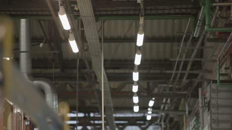 blurry images of a factory interior with bright fluorescent lights