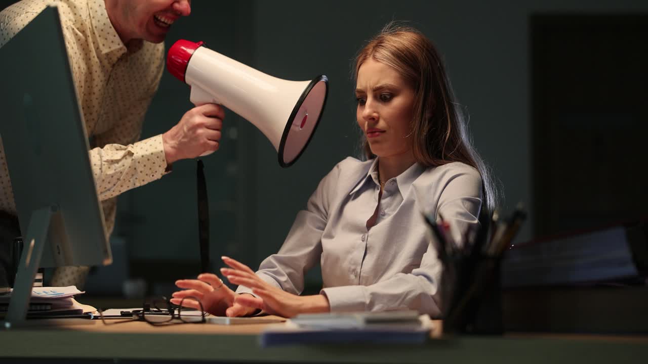 Boss yelling at employee with a megaphone