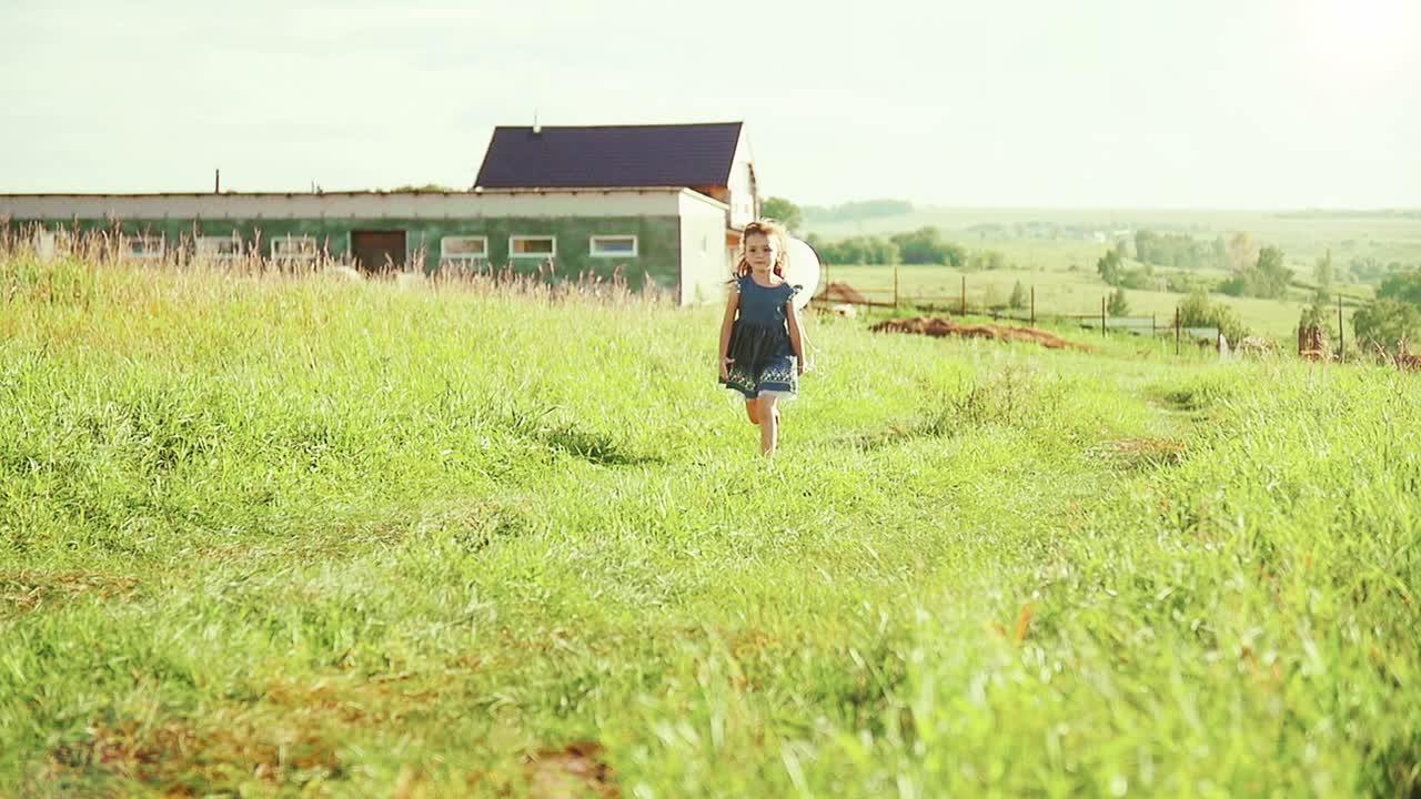 Young Girl Running Through a Field