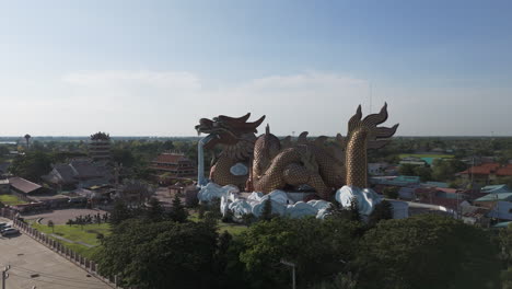 the dragon descendants museum with a massive fiberglass dragon in suphan buri, thailand. aerial drone shot