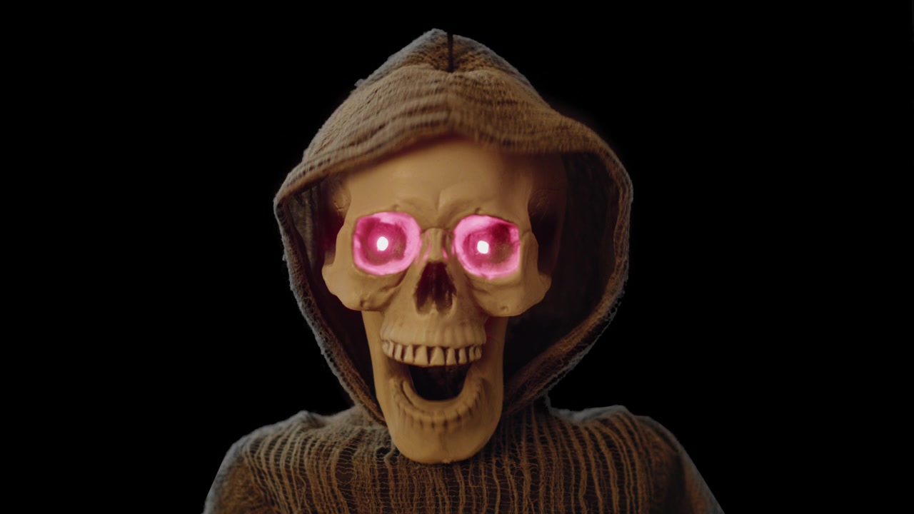Grim reaperHalloween decoration laughing on black void background