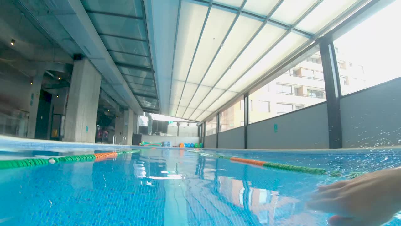 Swimming freestyle FPV in beautiful blue pool