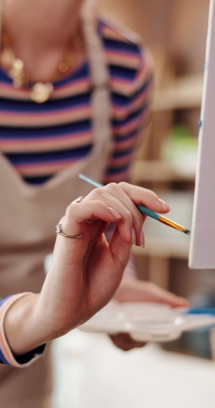 Artist Painting on Canvas in Art Studio