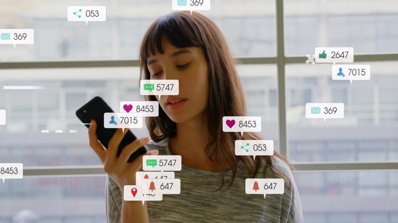 Woman holding phone, lowering, checking screen as social media likes appearing from right