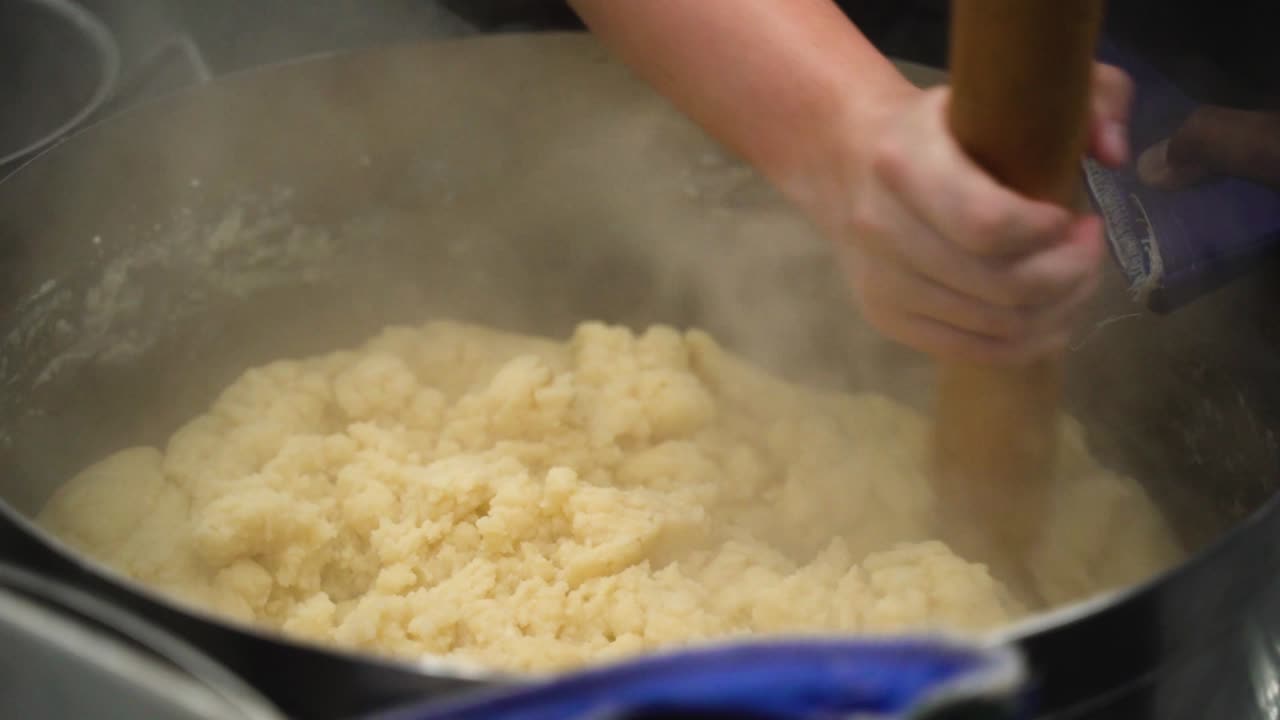 Mixing ingredients in a bowl in a restaurant kitchen. This was taken at a higher frame rate and has been converted to a slow motion video clip.