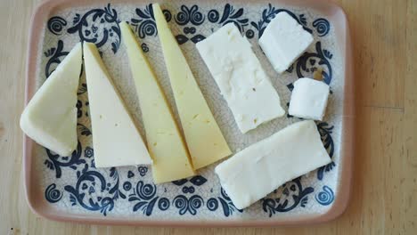 assorted cheeses on a plate