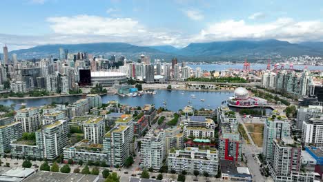 famous canadian landmarks across false creek seen from mount pleasant in vancouver, canada