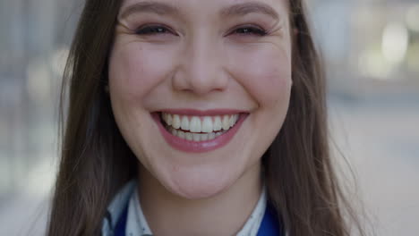 close up portrait beautiful young woman laughing running hand through hair enjoying happy lifestyle success lively feminine beauty slow motion