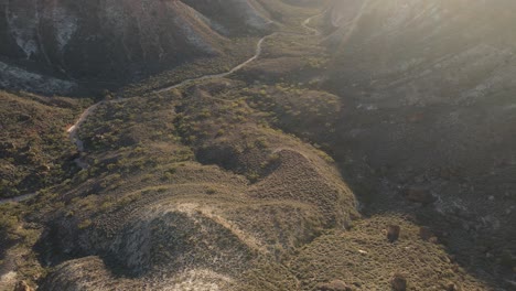 High-drone-view-over-a-spectacular-mountain-cliffs-of-charles-Knife-Canyon-on-a-foggy-day-during-sunrise-In-Exmouth,-Western-Australia-Slow-motion