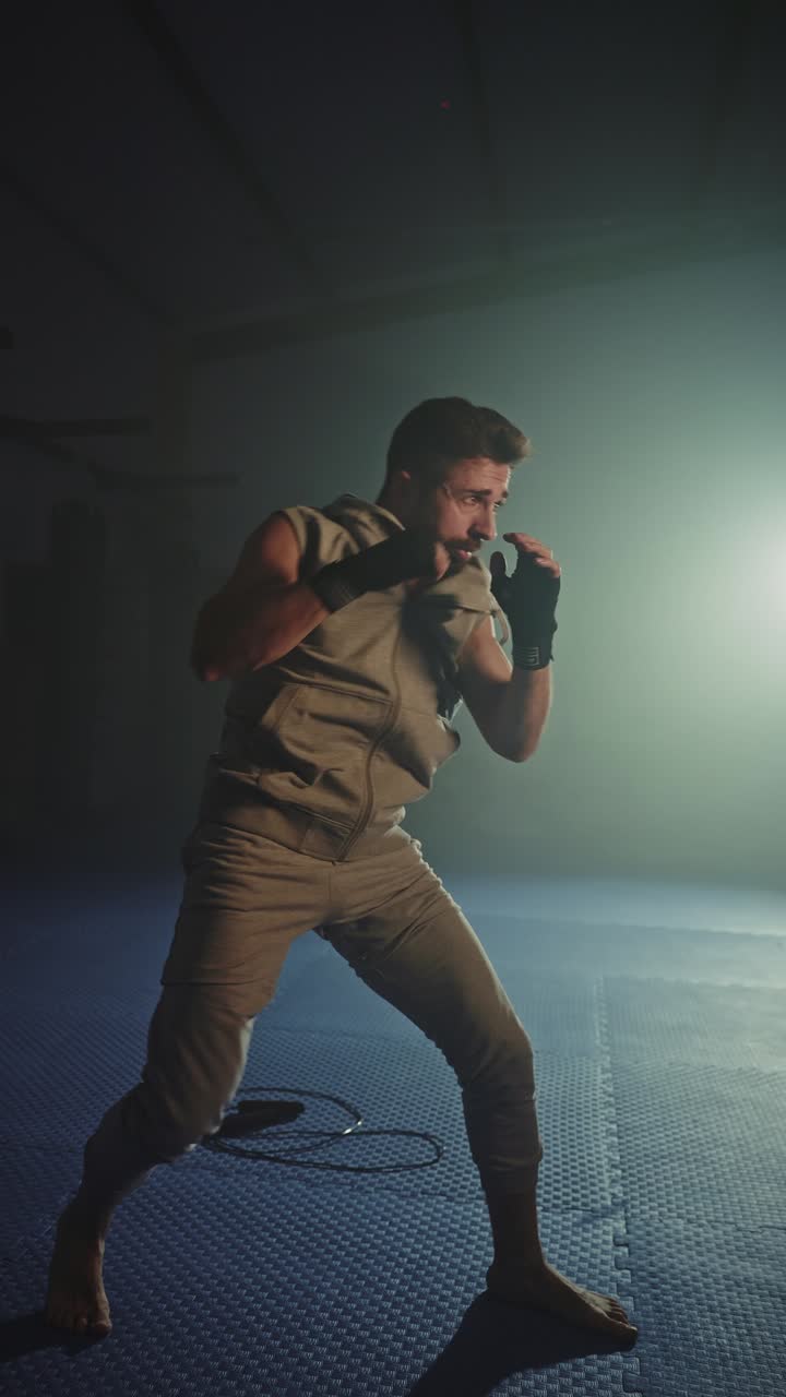 Man Practicing Boxing in a Gym