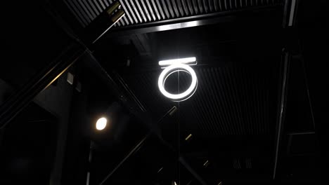 a decorated sign with lighting in an outdoor place close up shot, tilt right shot, tilt left shot