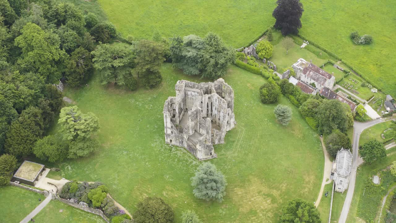 Aerial view of ruins of medieval castle in Wiltshire, a tourist attraction in English countryside