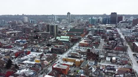 Aerial-shot-flying-around-snowy-downtown-neighborhood-in-Hamilton