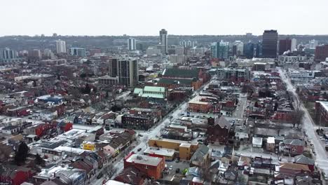 aerial shot flying around snowy downtown neighborhood in hamilton