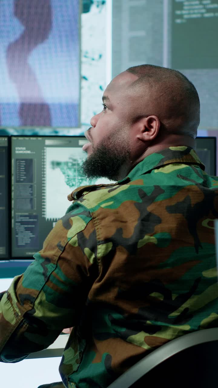 Vertical Video High tech military office with soldiers analyzing real time data