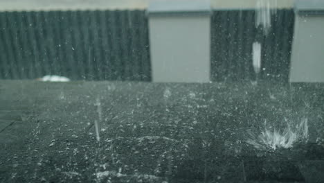 view from the window of the house on the part of the roof, where there is a heavy downpour