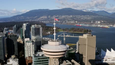 Canadian-Flag-Waving-In-The-Wind-At-Vancouver-Lookout-In-Harbour-Centre-In-Downtown-Vancouver,-BC,-Canada