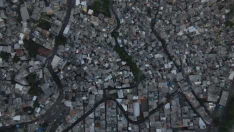 Panning-drone-shot-of-favela-Rocinha-in-Rio-de-Janeiro,-Brazil