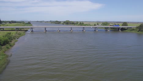 Aerial-View-Of-Macleay-Valley-Bridge-Over-Macleay-River-On-A-Sunny-Day-In-Frederickton,-New-South-Wales,-Australia