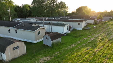 aerial rising shot of beautiful sunset over mobile home park