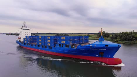 vessel tailwind panda 002 container ship sailing in the river