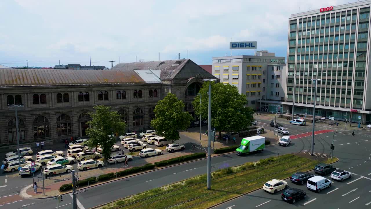 4K Aerial Drone Video of the Taxi Stand in front of the Hauptbahnhof Train Station in Downtown Nürnberg, Germany
