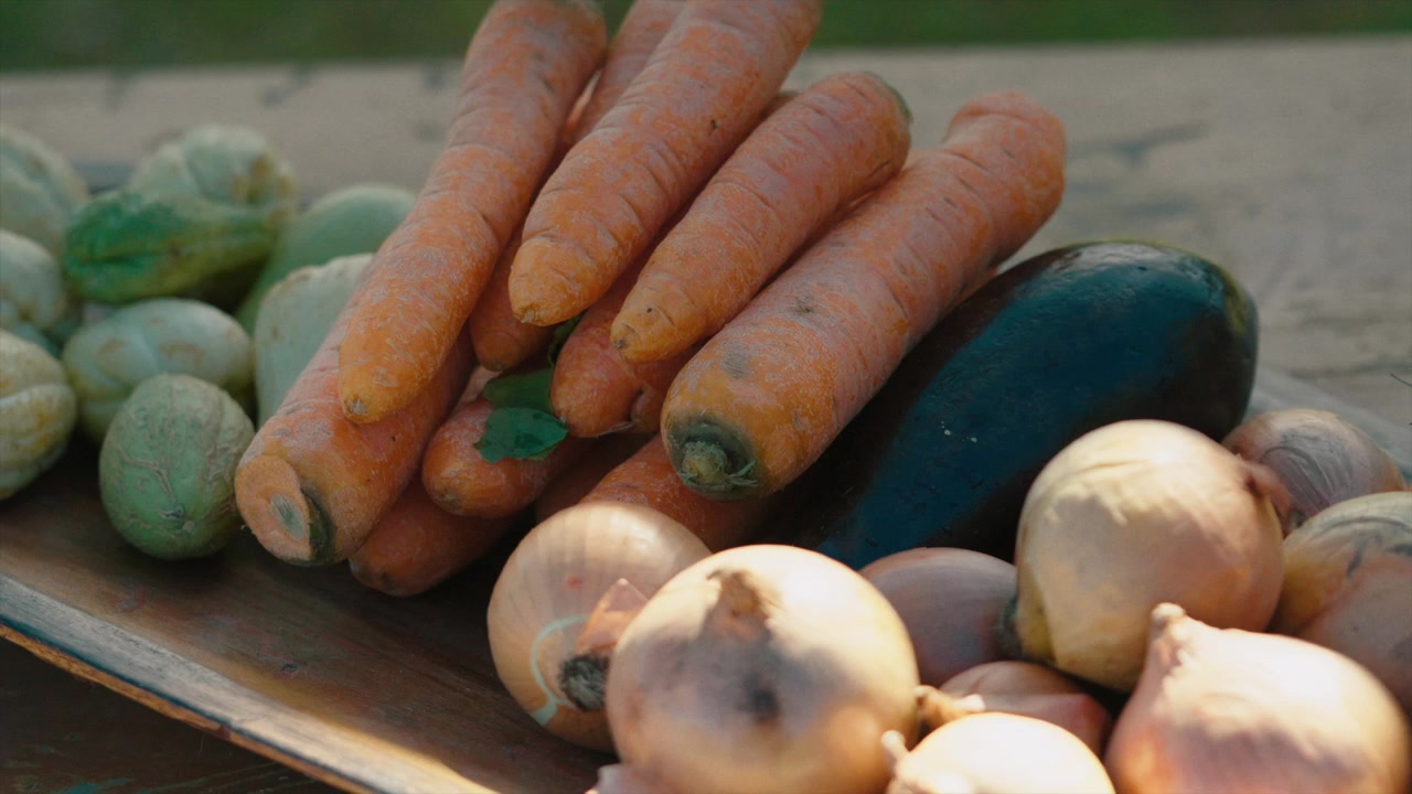 Fresh and colorful vegetables arranged on wooden table ready to serve, close up