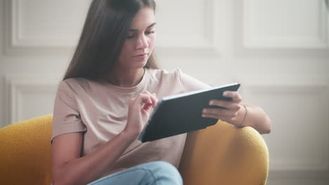 young woman using tablet