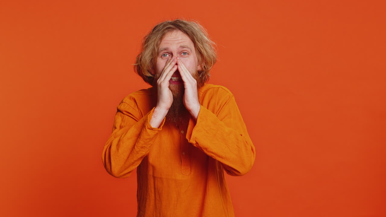 Caucasian young man whisper news rumors holding hands near mouth share gossip quiet keep my secrets