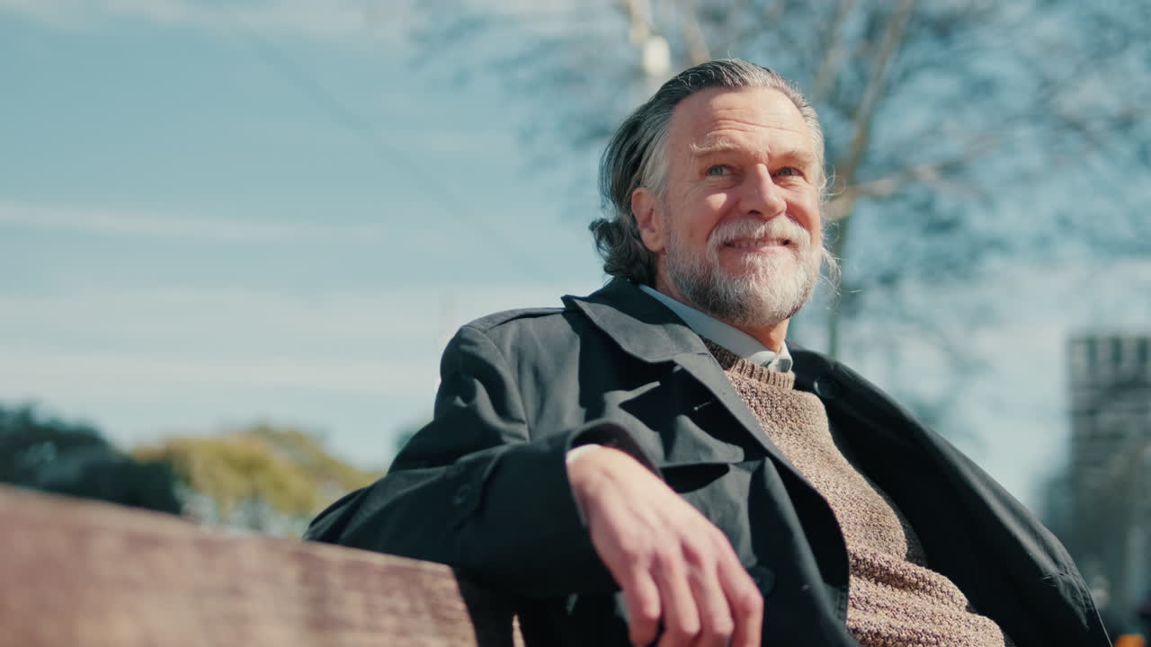 Happy Senior Man Enjoying Sunny Day In Park