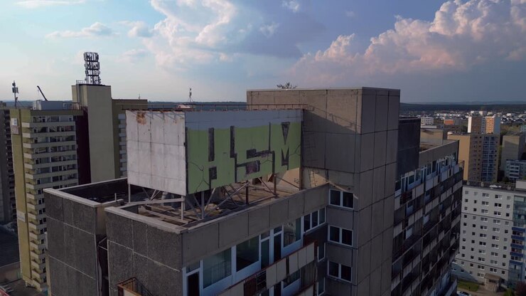 halle neustadt damaged plattenbau Prefabricated building, saxony anhalt, germany, damaged buildings. Fabulous aerial view flightlift off raise up drone