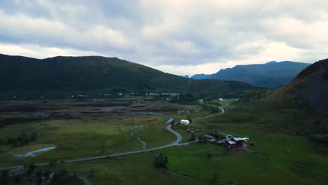 Aerial:-overseeing-the-mountains-and-farmland-in-Lofoten,-Norway