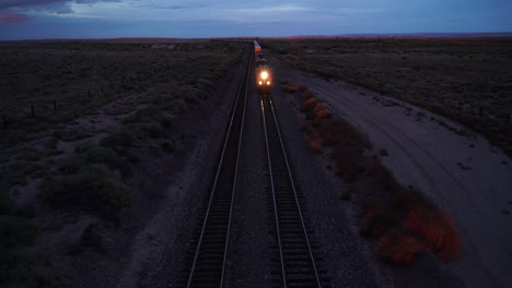 approaching freight train in arizona with headlights on