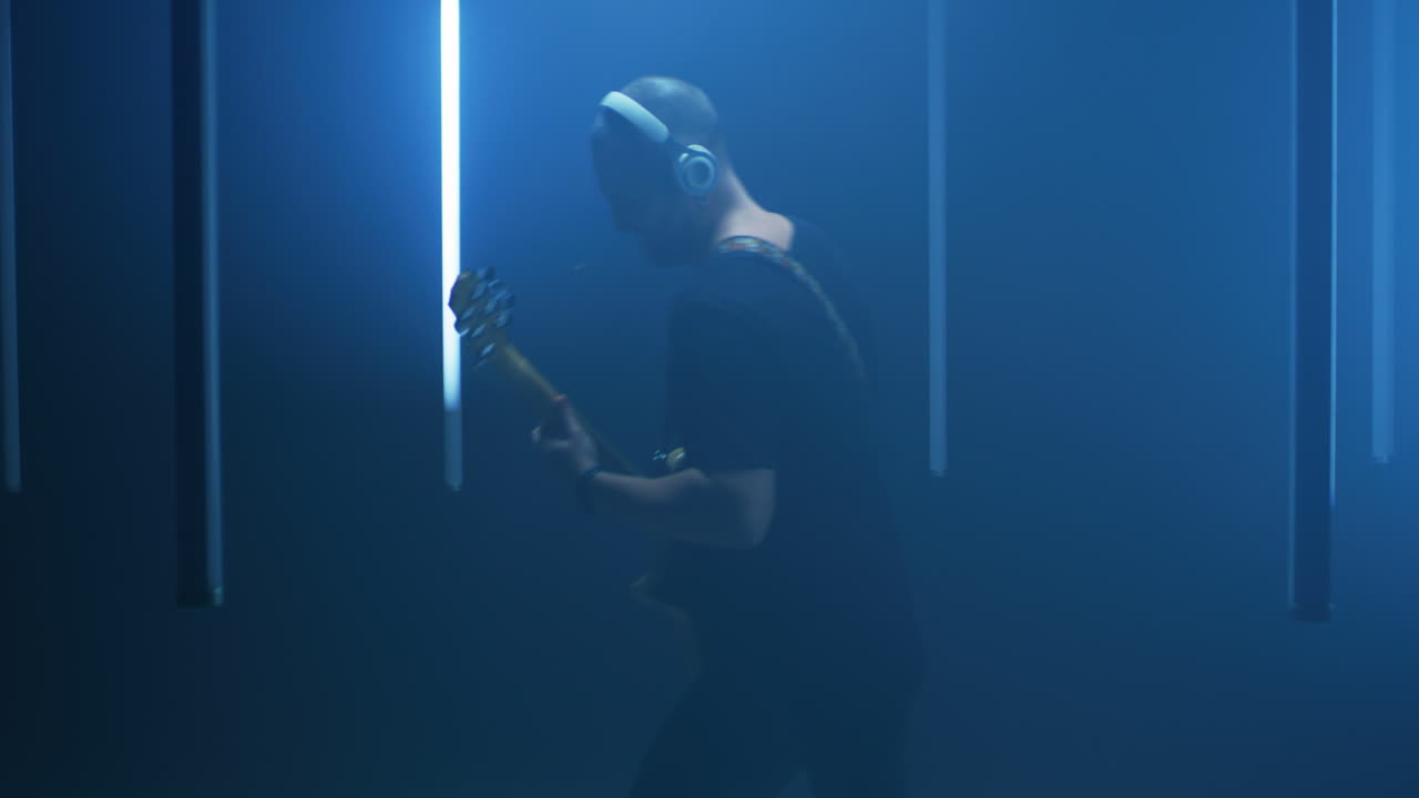 Musician Playing Guitar in a Studio