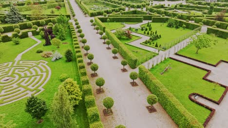 drone footage of baroque rundale palace gardens with green maze and symmetry