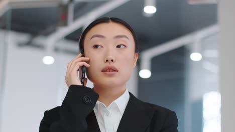 business woman on phone call in modern office