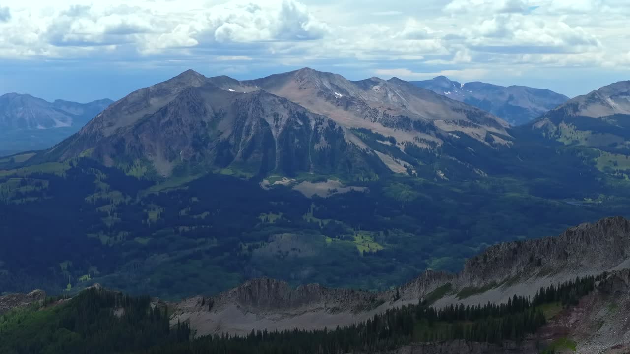Marcellina Mountain Kebler Pass Crested Butte Colorado aerial drone spring summer morning afternoon daytime Ruby Peak Rocky Mountains Gunnison National Forest cloudy parallax circle right motion