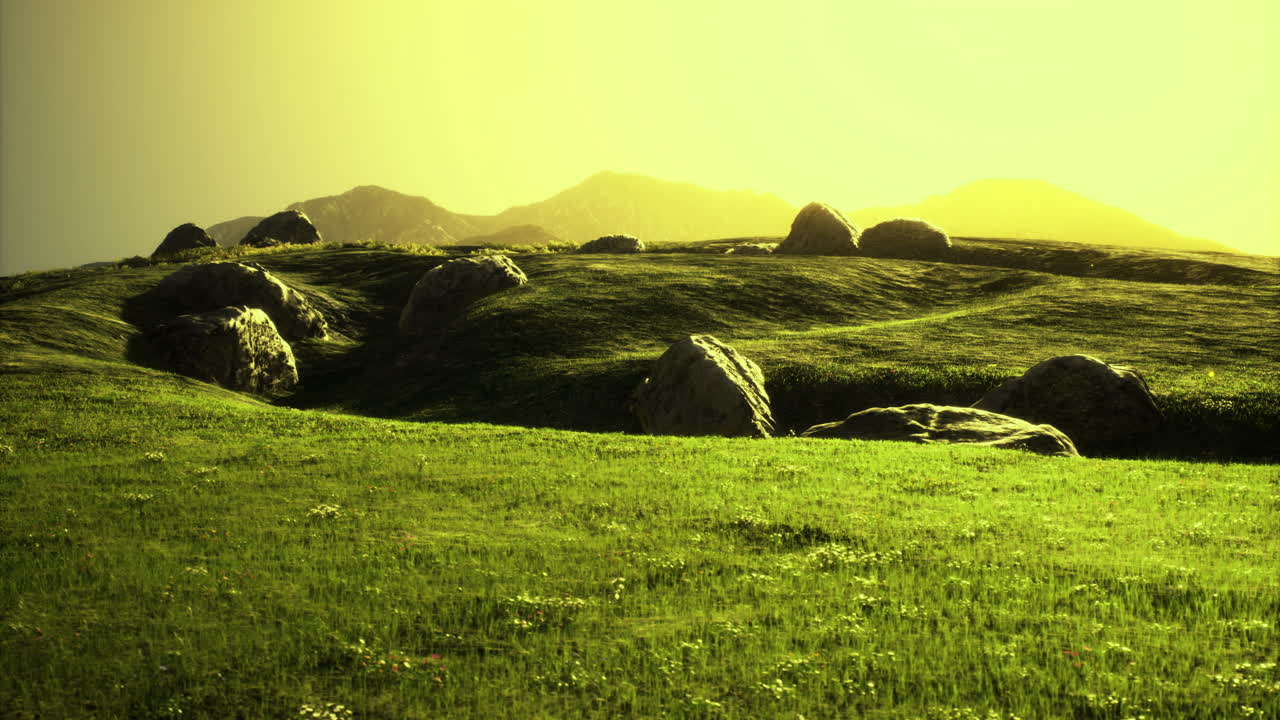 Vibrant green landscape with rocks and gentle hills during sunset light