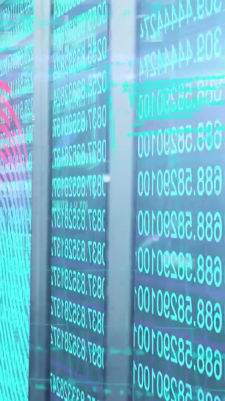 Vertical video: Camera panning displays showing scrolling teal digits, red spiral for tech demo