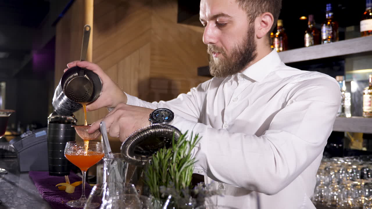 Bartender Pouring Cocktail at Bar