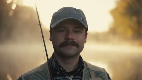 man fishing in the morning fog