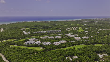 akumal mexico aerial v13 flyover riviera maya golf course capturing gran bahia principe luxury complex surrounded by jungle nature with expansive ocean views - shot with mavic 3 pro cine - july 2023