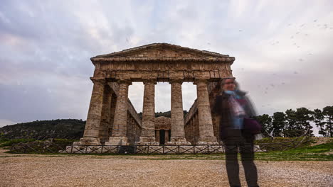 time lapse shot of the doric temple of segesta with dense flying clouds at sky