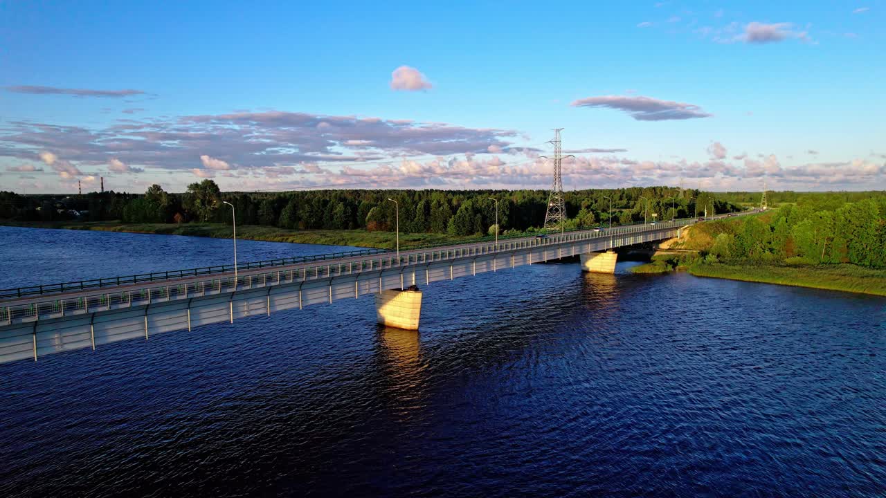 Stunning aerial view of a bridge over water in Latvia at sunset