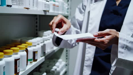 pharmacist checking prescription