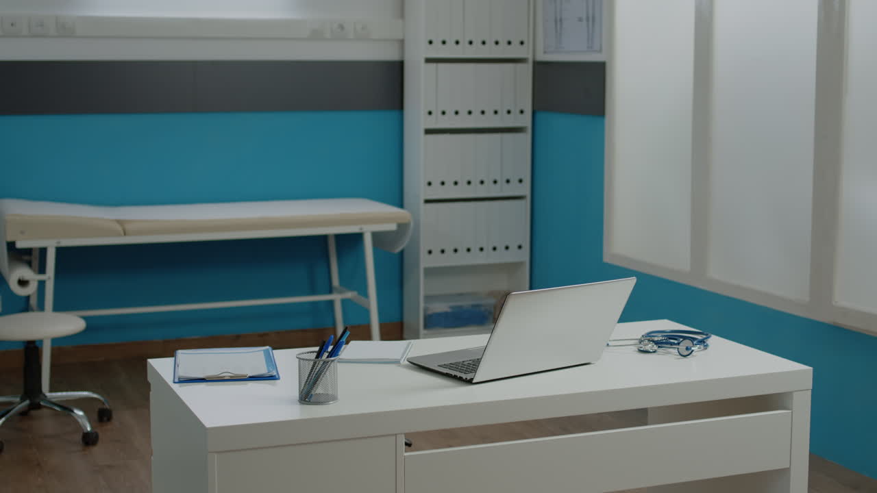 Doctor's office with laptop and medical equipment