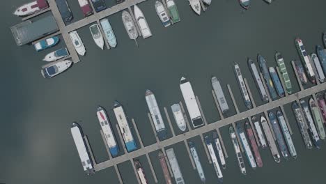 marina, boat mooring, narrowboat, leisure cruiser, bird's-eye-view aerial overhead uk dull day water 4k travel transportation