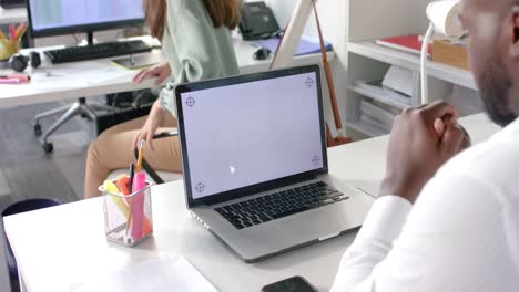 African-american-casual-businessman-having-laptop-video-call-with-copy-space-on-screen,-slow-motion