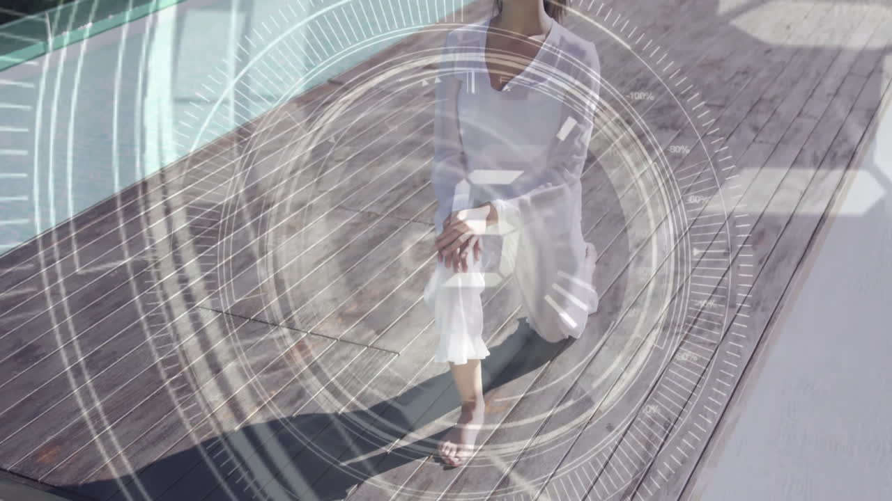 나무 갑판에 앉아있는 여성 위의 원형 디지털 인터페이스 애니메이션