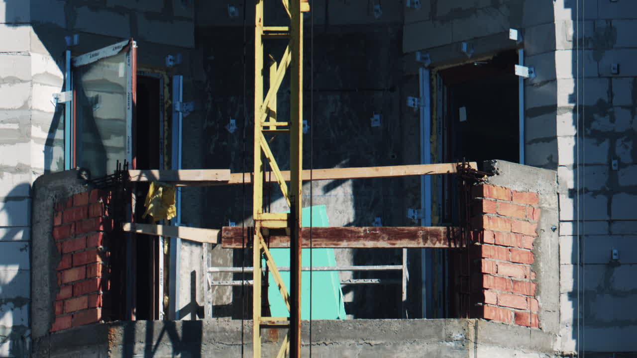 Close up of a building under construction with unfinished balcony and construction elements